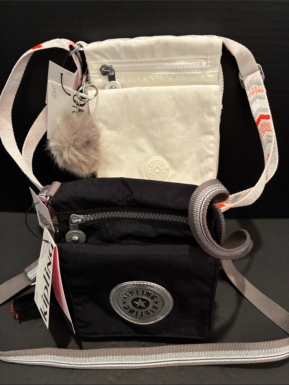 Kipling 2 Crossbody Bags — Black and White with Patterned Strap and Pom Charm